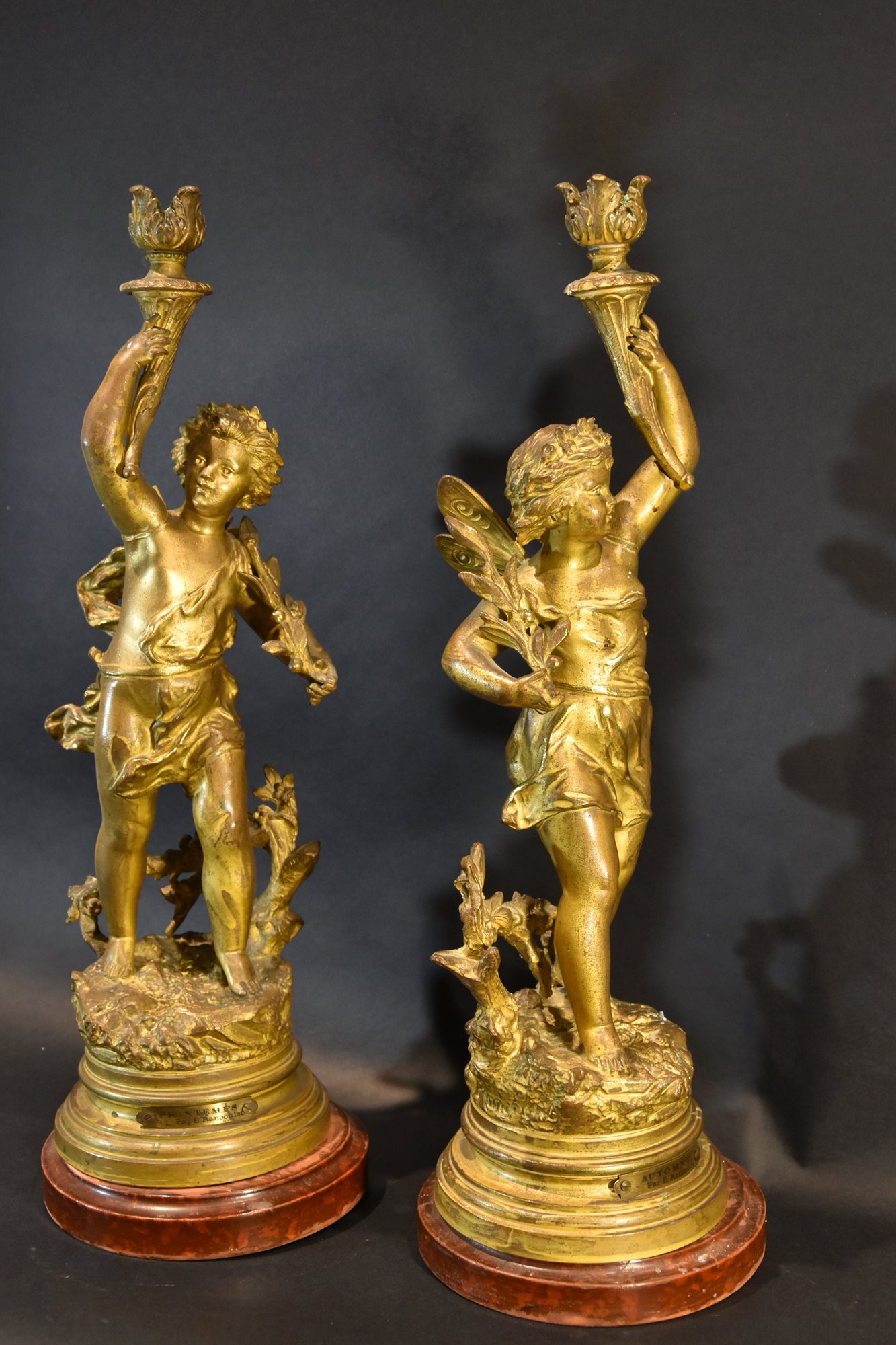 Coppia di candelieri in bronzo dorato 'Allegoria dell’Autunno e della Primavera'